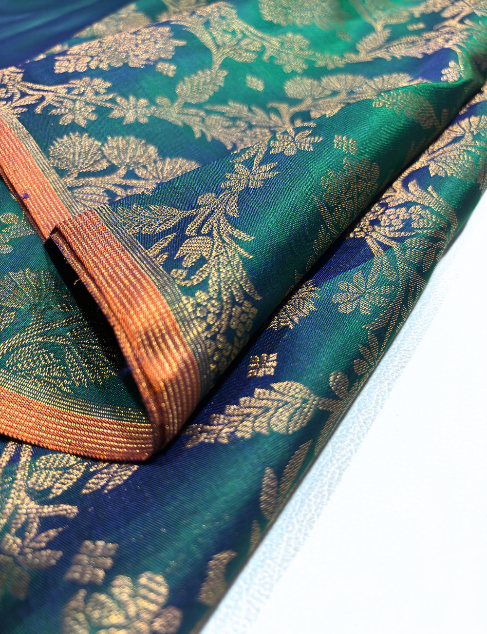 Borderless Kanchipuram Handloom Silk Saree – Peacock Green & Orange with Gold Zari Floral Weaving